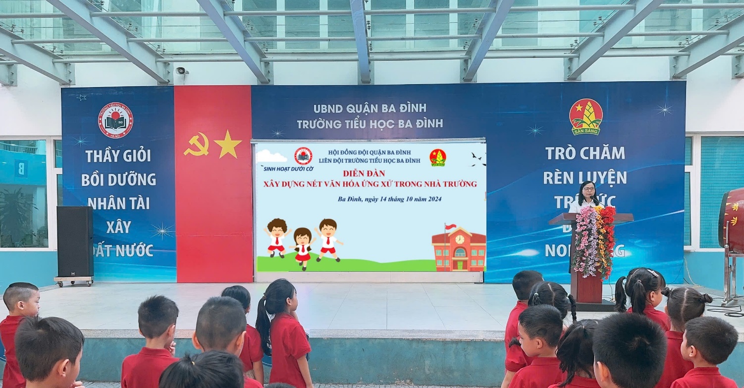 A group of children standing in front of a sign

Description automatically generated