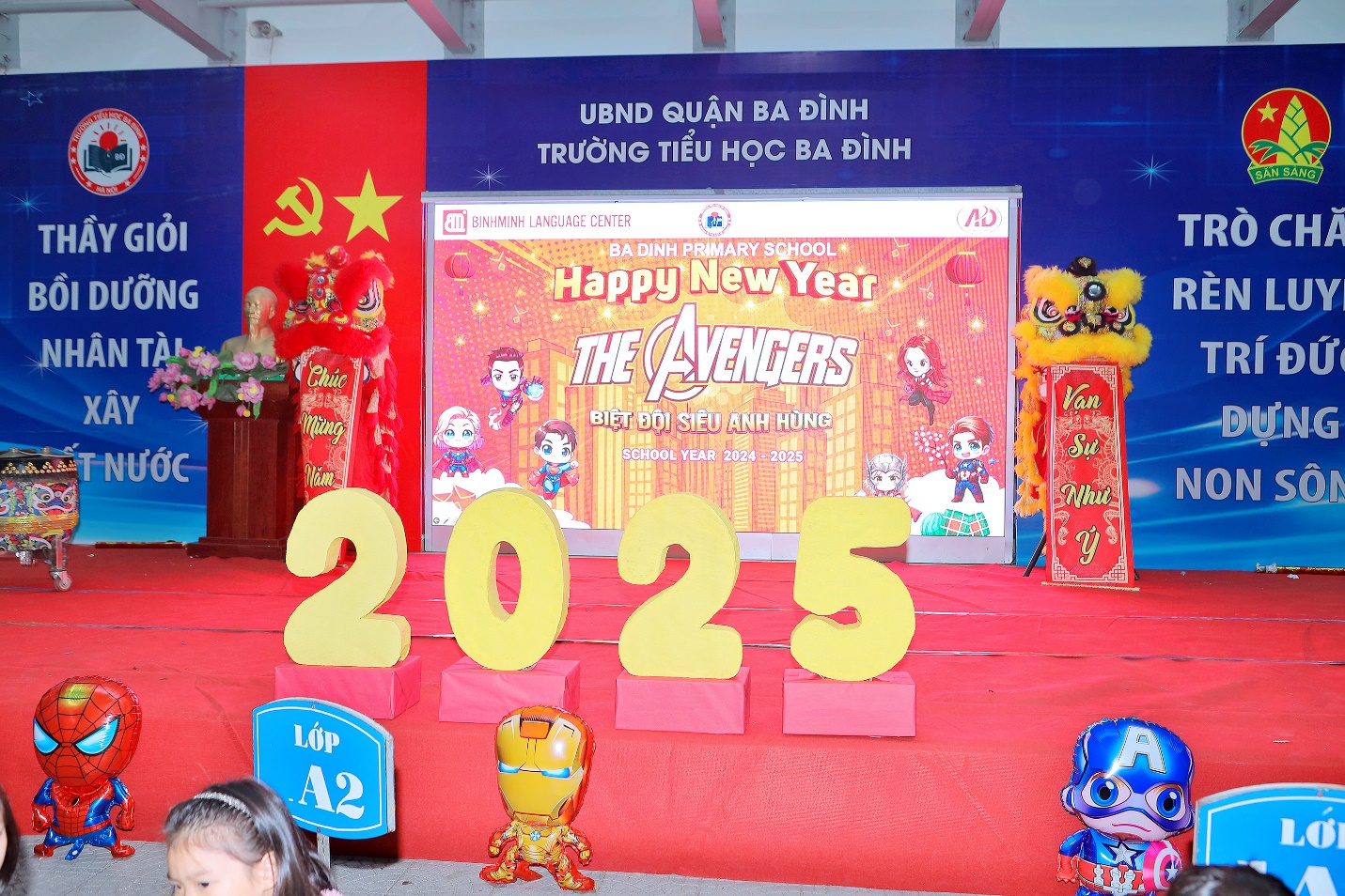 A stage with a sign and figures

Description automatically generated with medium confidence