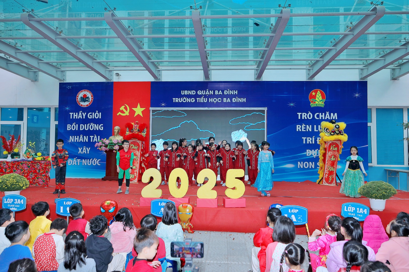 A group of children performing on a stage

Description automatically generated
