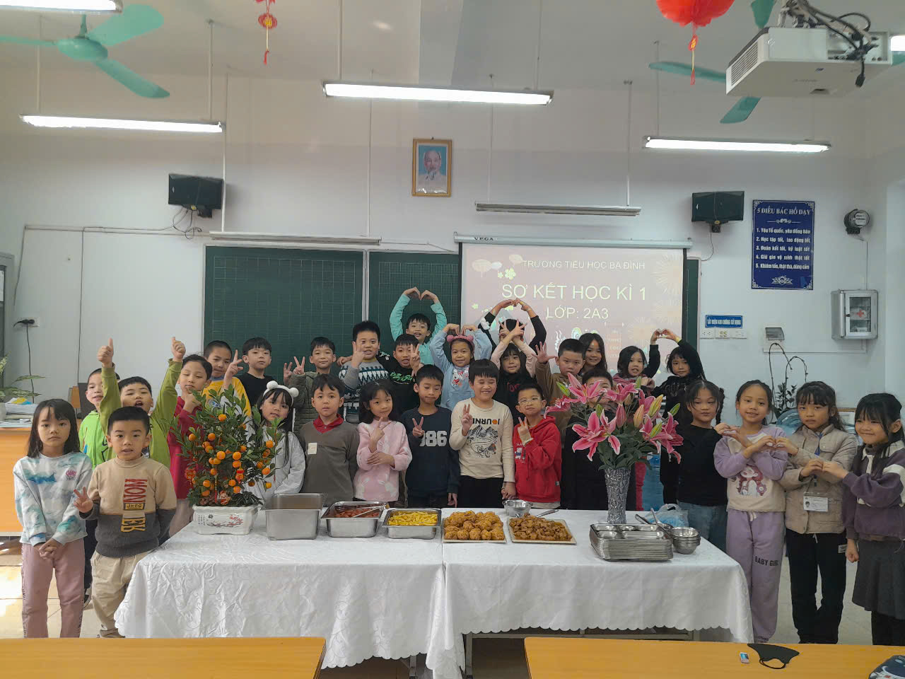 A group of children standing in a classroom

Description automatically generated