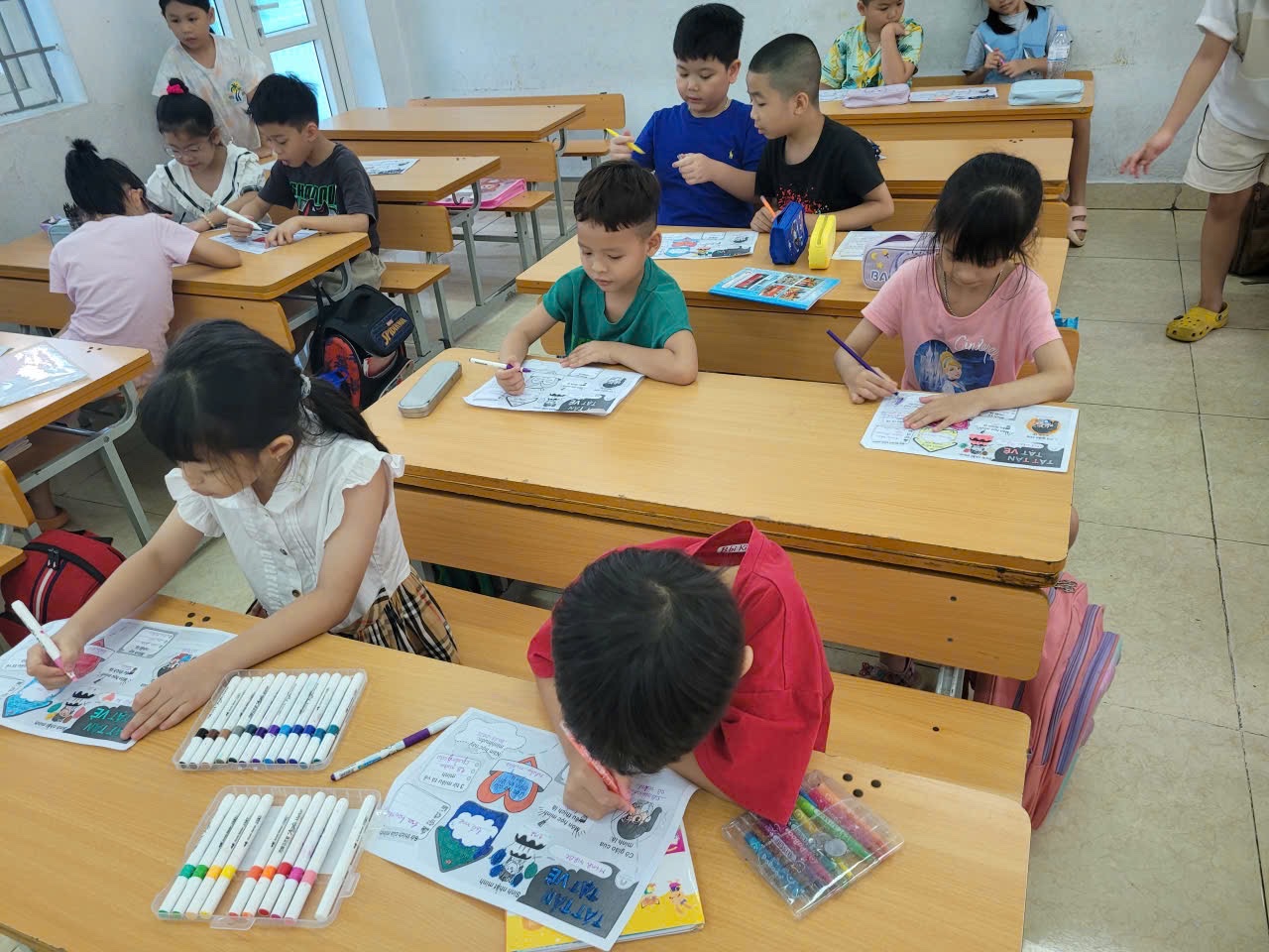 A group of children sitting at desks in a classroom

AI-generated content may be incorrect.