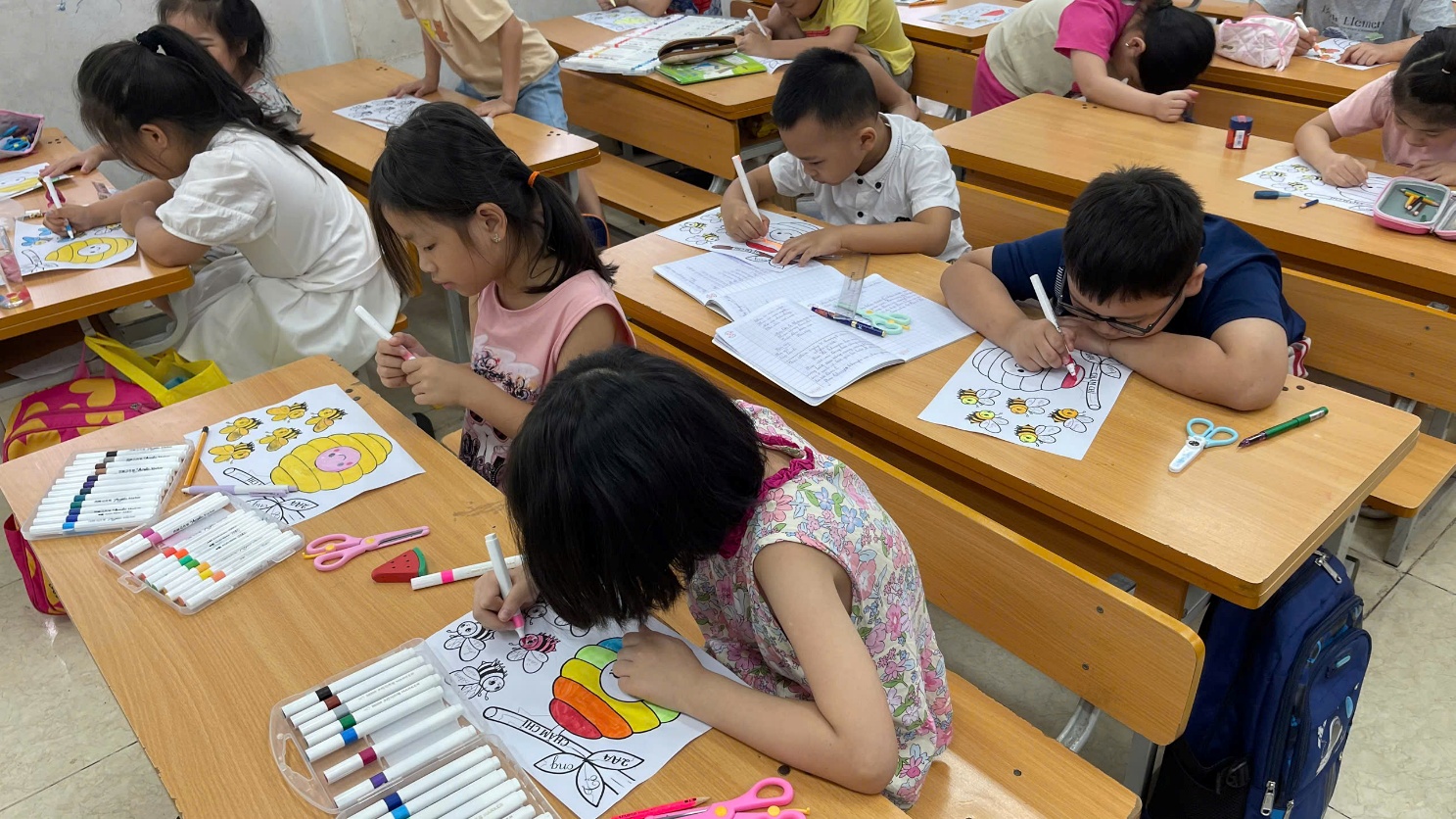 A group of children coloring at desks

AI-generated content may be incorrect.