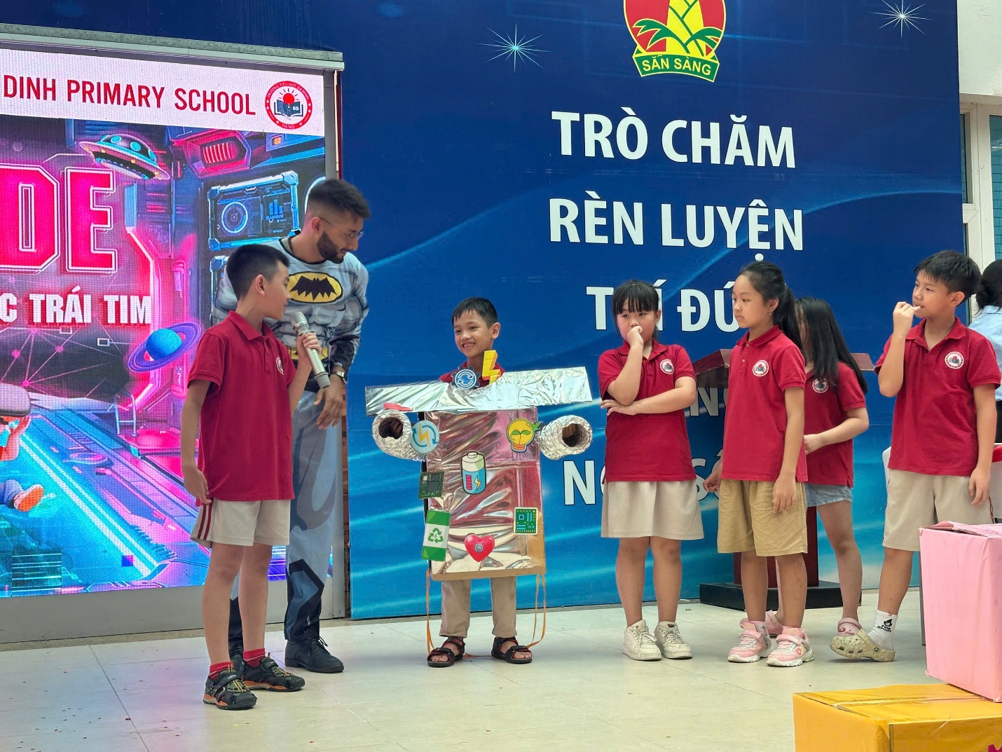 A group of children standing next to a person

AI-generated content may be incorrect.