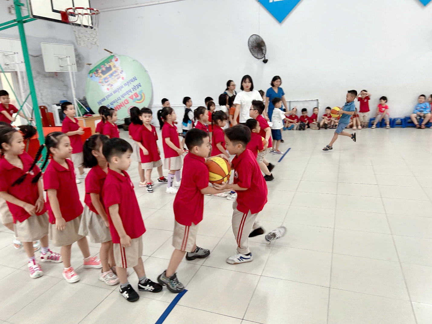 A group of children in red shirts

AI-generated content may be incorrect.