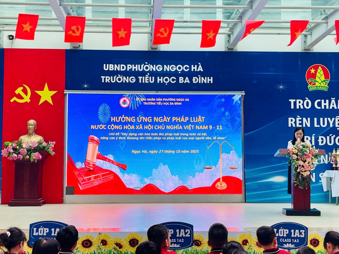 A person standing at a podium in front of a screen with a flag

AI-generated content may be incorrect.