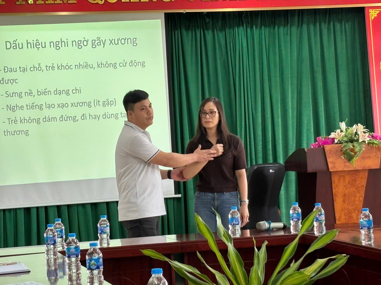 A person and person standing in front of a screen

AI-generated content may be incorrect.