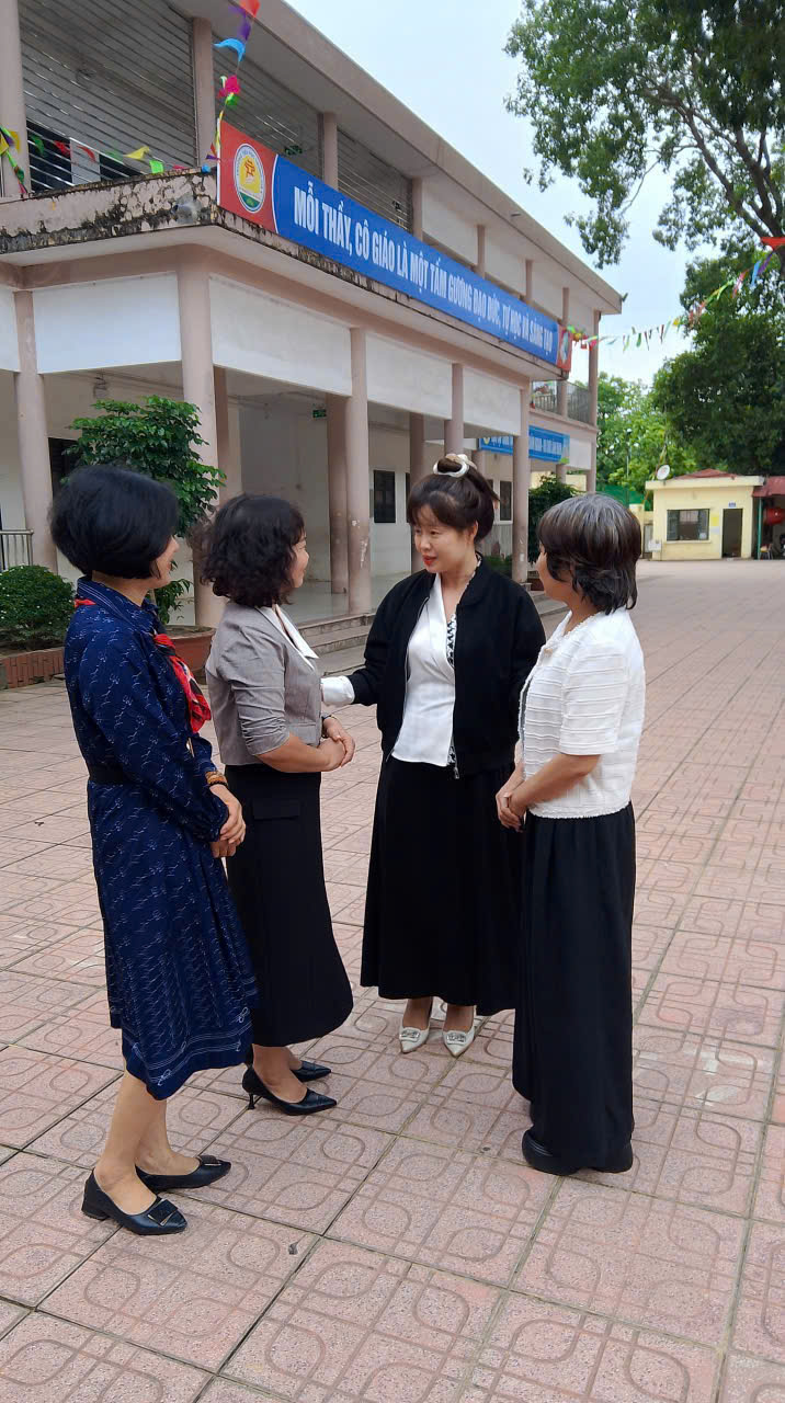 A group of women standing outside a building

AI-generated content may be incorrect.
