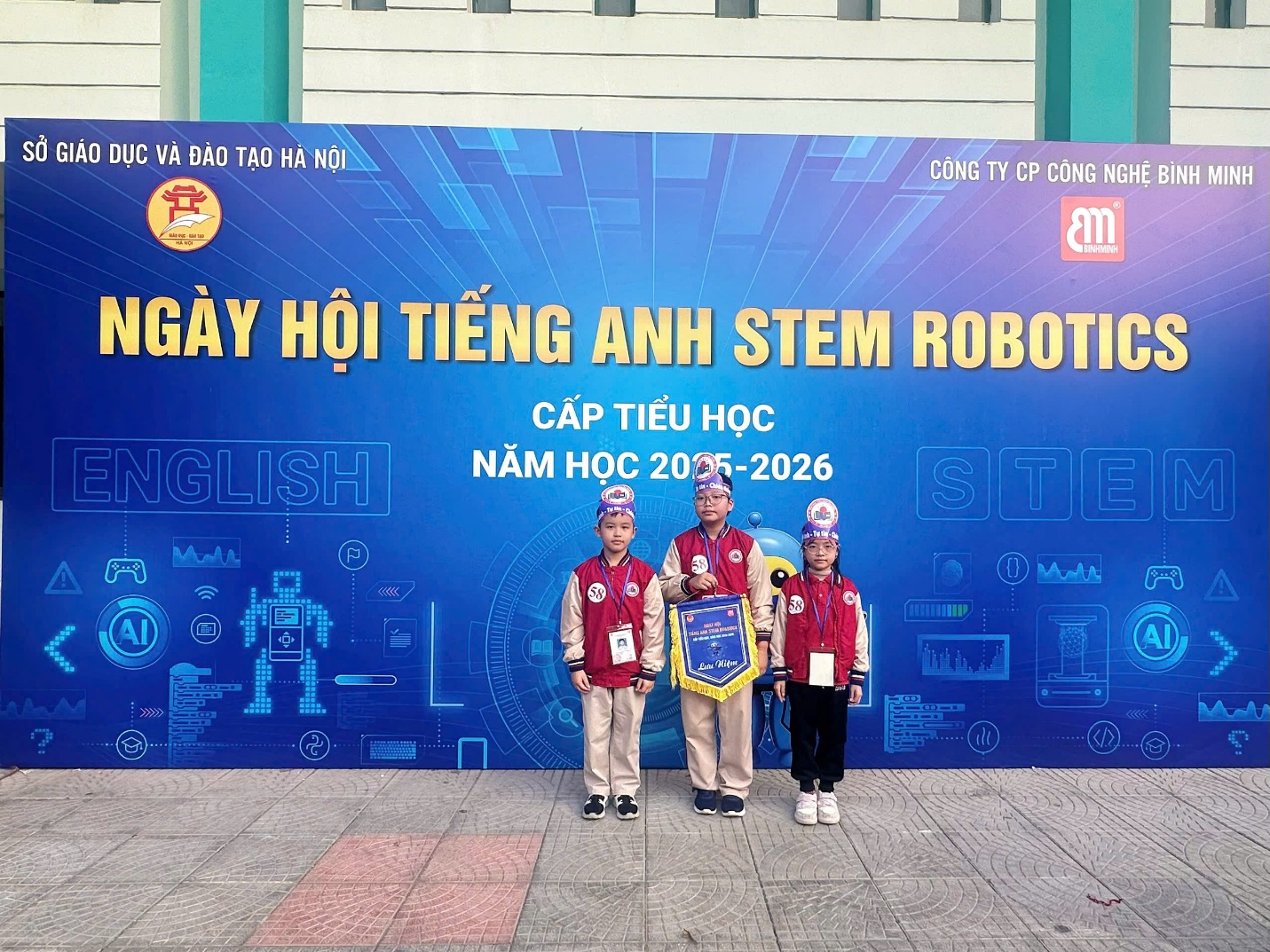 A group of people standing in front of a banner

AI-generated content may be incorrect.