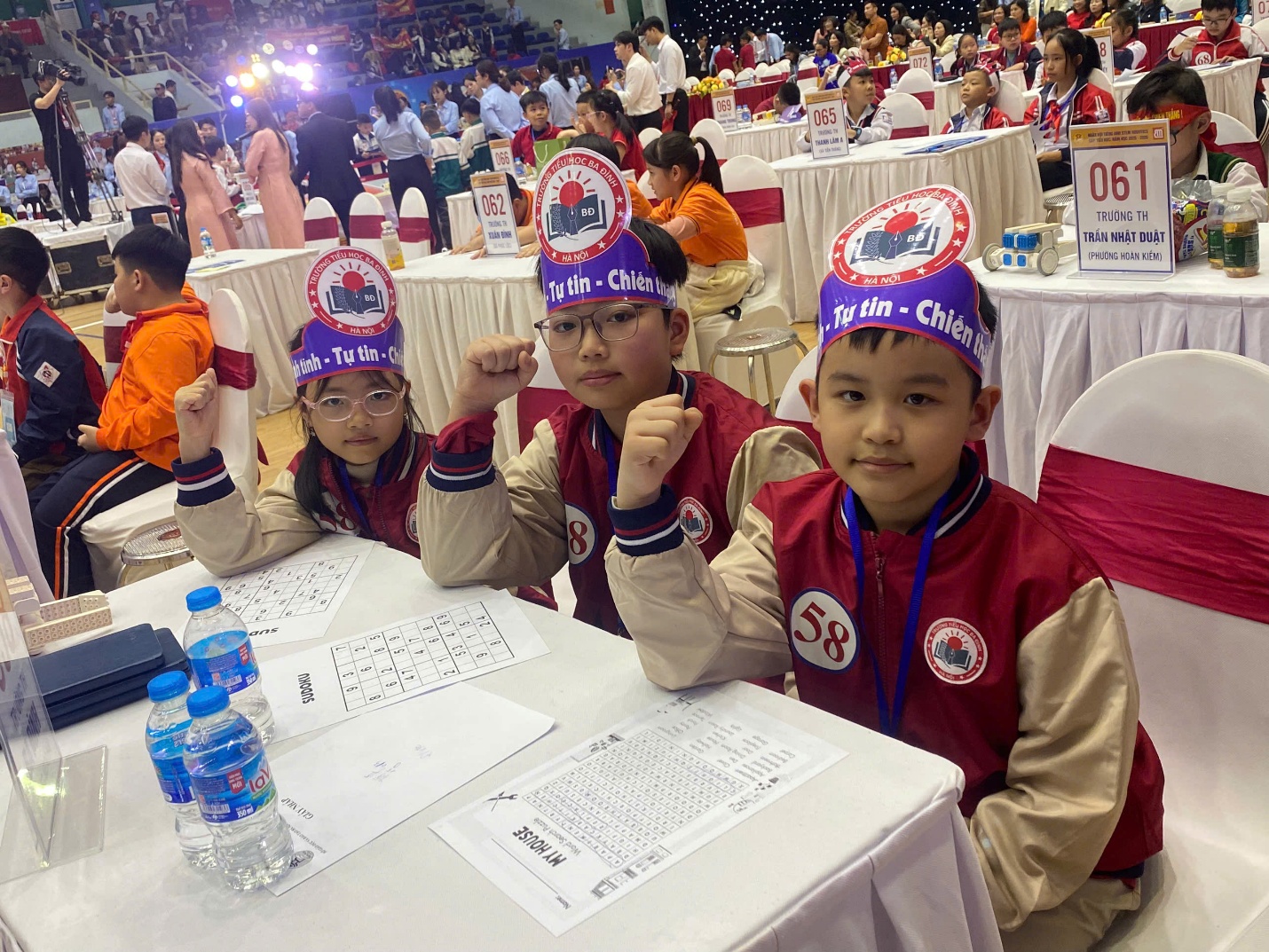 A group of kids sitting at tables with tables and chairs with tables and chairs

AI-generated content may be incorrect.