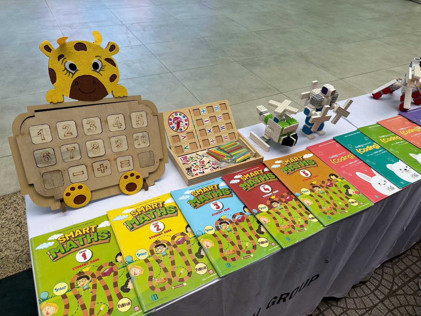 A table with books and toys

AI-generated content may be incorrect.