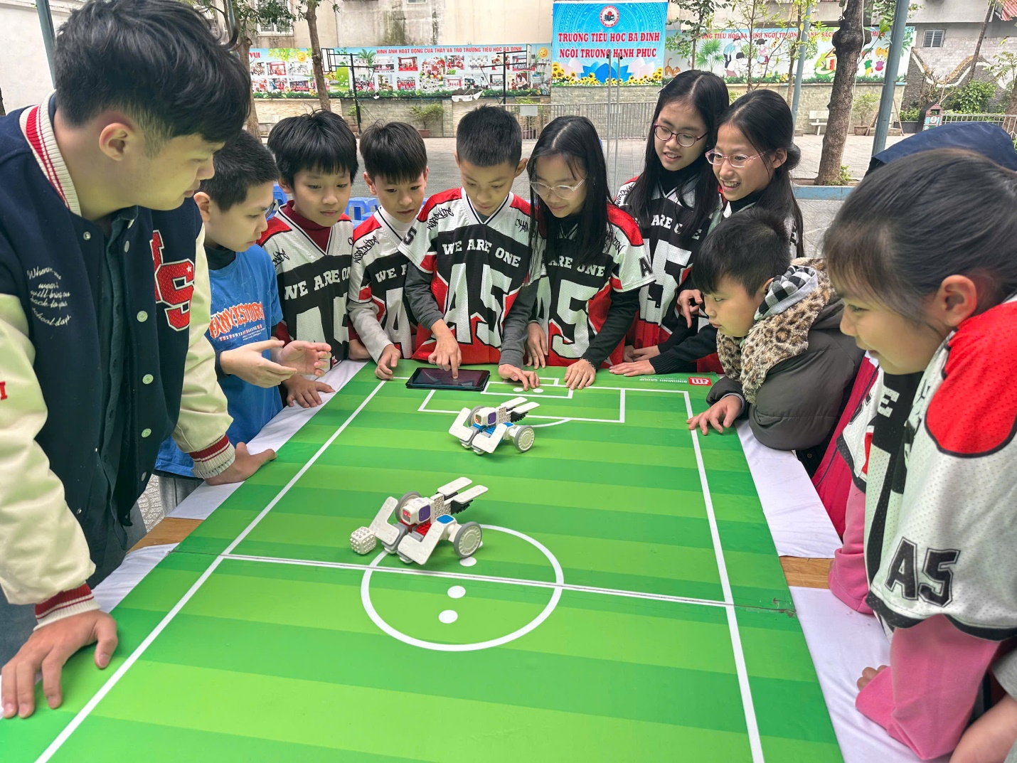 A group of children around a table

AI-generated content may be incorrect.