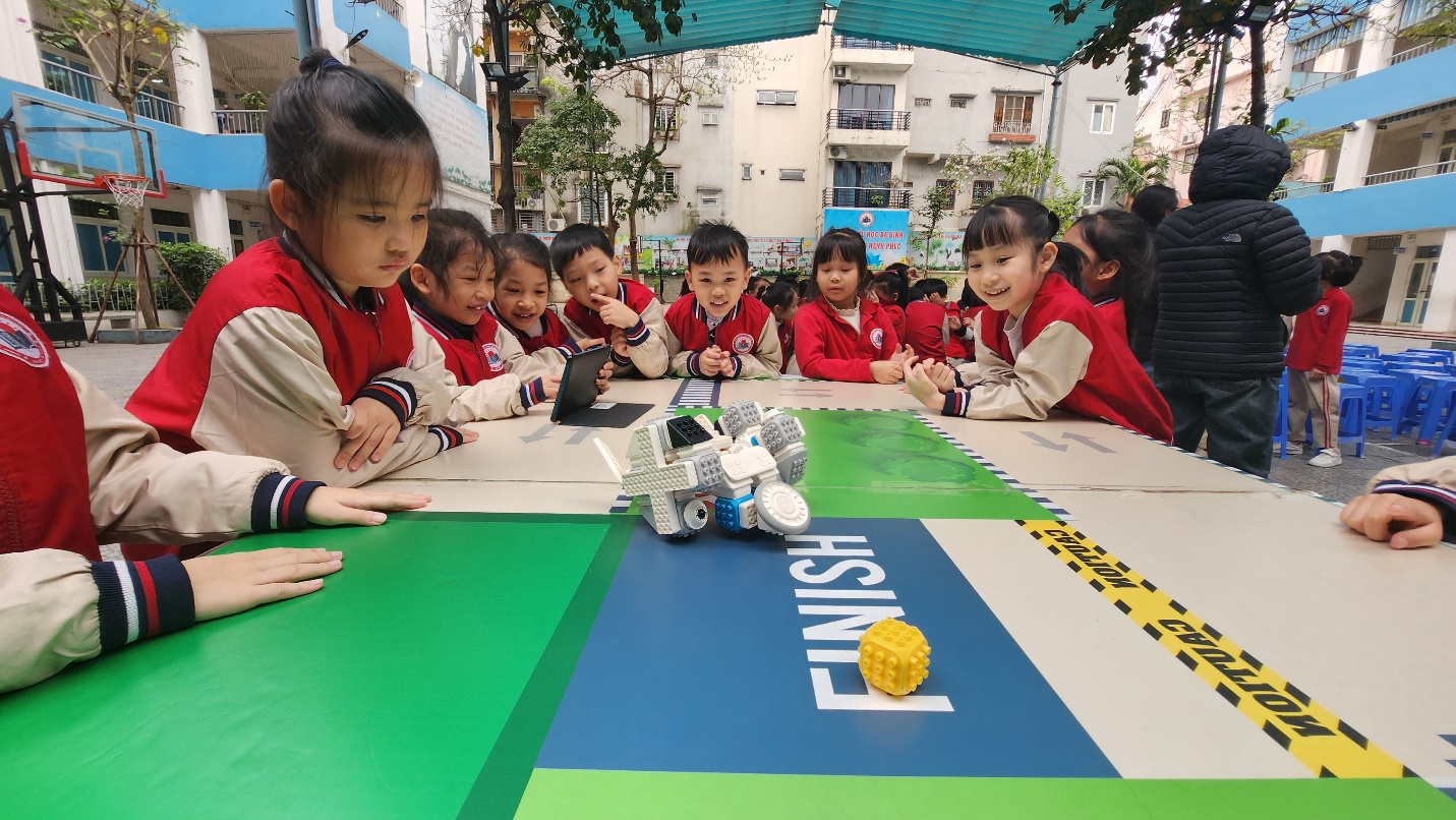 A group of children sitting around a table

AI-generated content may be incorrect.