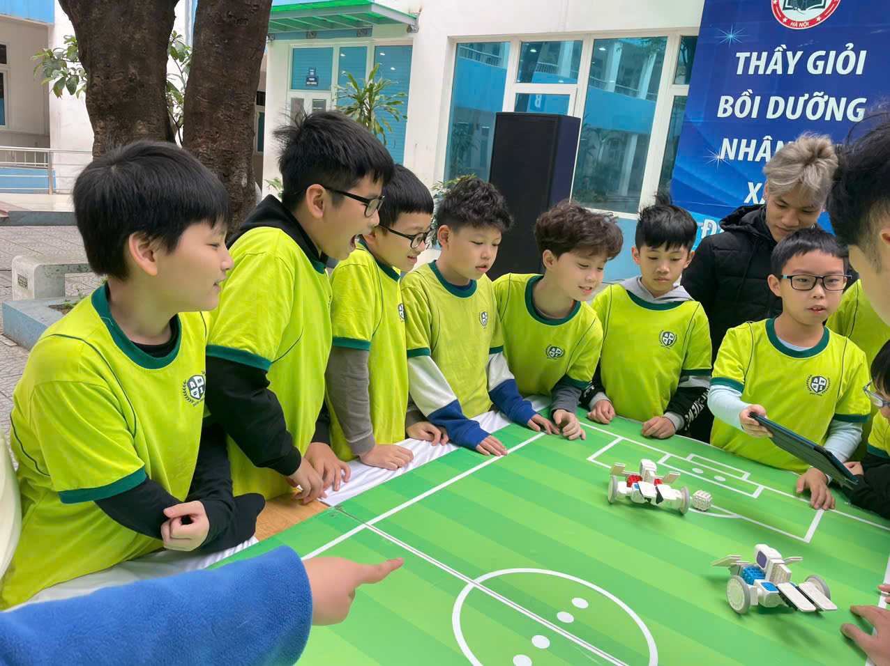 A group of boys in green shirts playing a game

AI-generated content may be incorrect.
