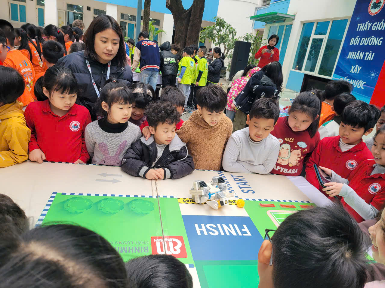 A group of children sitting around a table

AI-generated content may be incorrect.