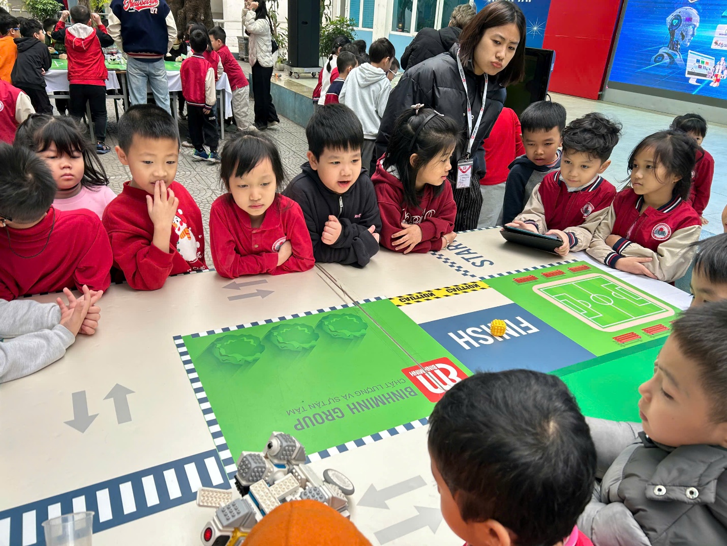 A group of children sitting around a table

AI-generated content may be incorrect.
