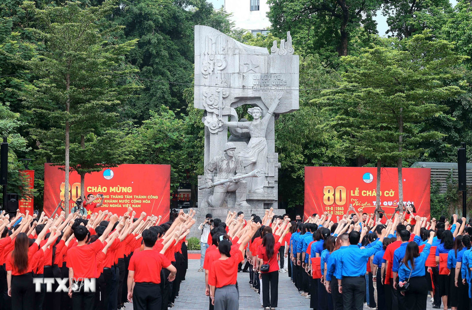 A group of people in red shirts saluting

AI-generated content may be incorrect.
