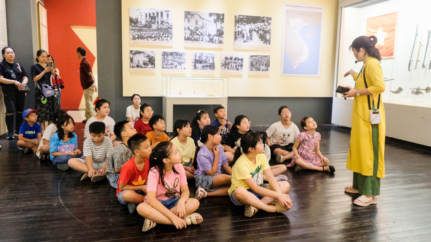 A group of children sitting on the floor

AI-generated content may be incorrect.