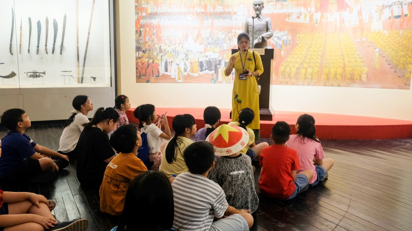 A person standing in front of a group of children

AI-generated content may be incorrect.