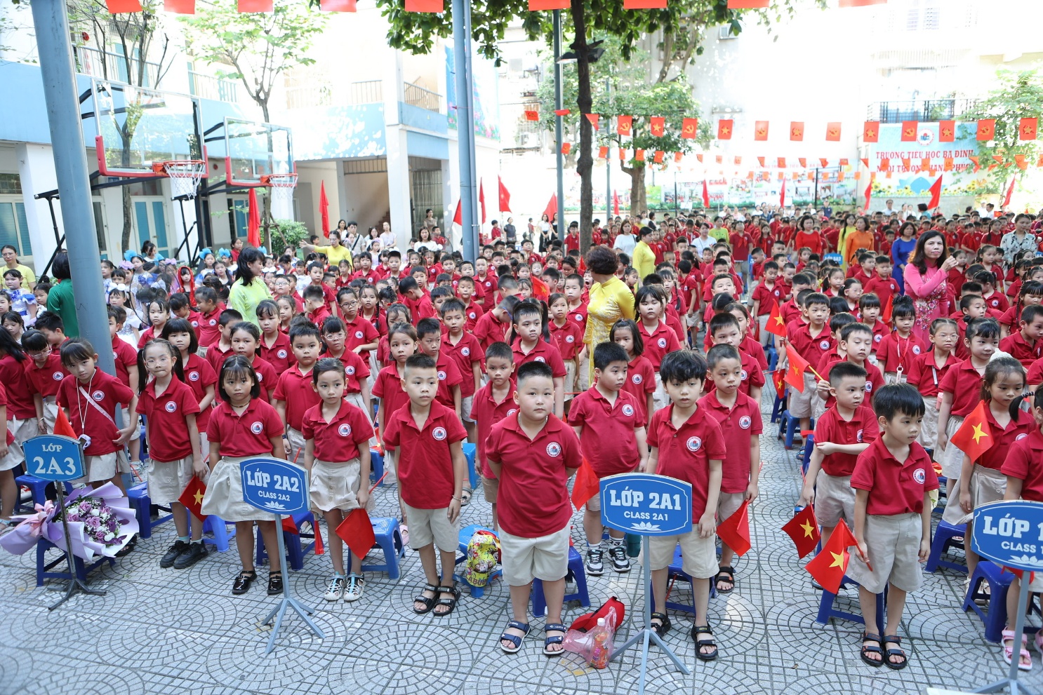 A group of children wearing red shirts

AI-generated content may be incorrect.