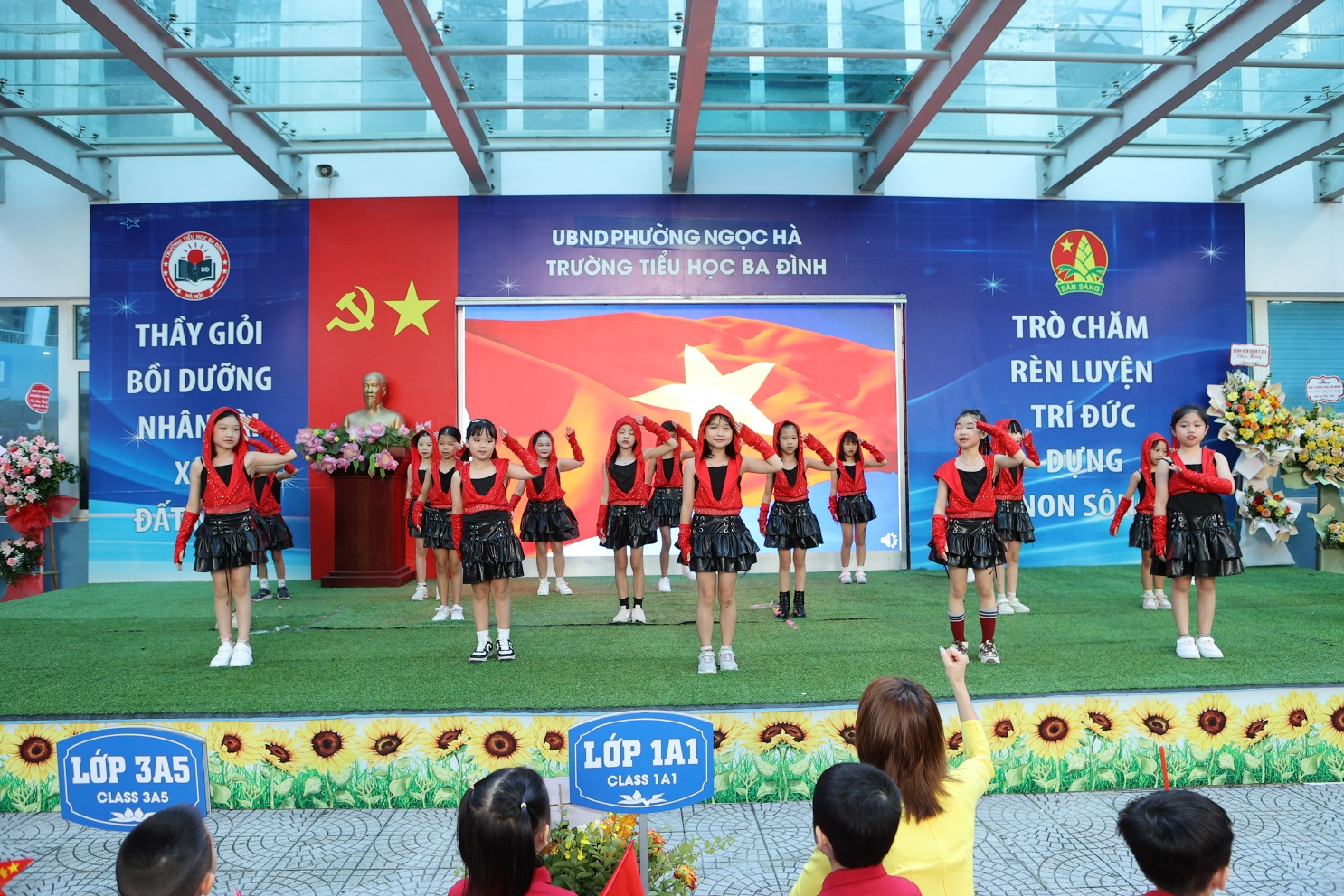 A group of girls performing on a stage

AI-generated content may be incorrect.