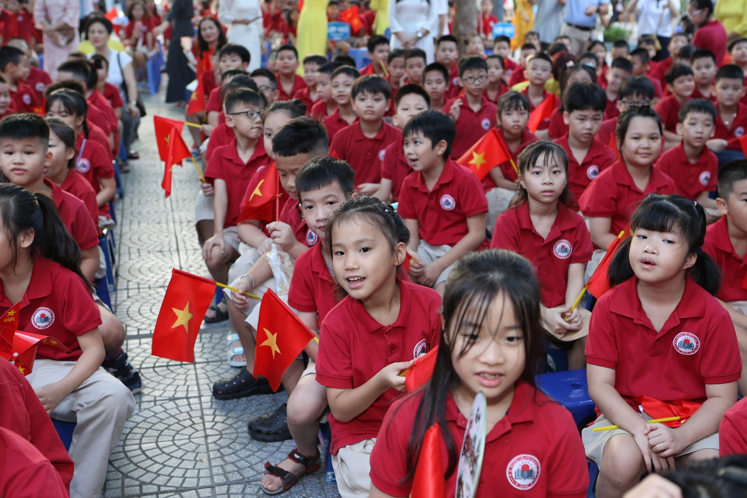 A group of children in red shirts

AI-generated content may be incorrect.