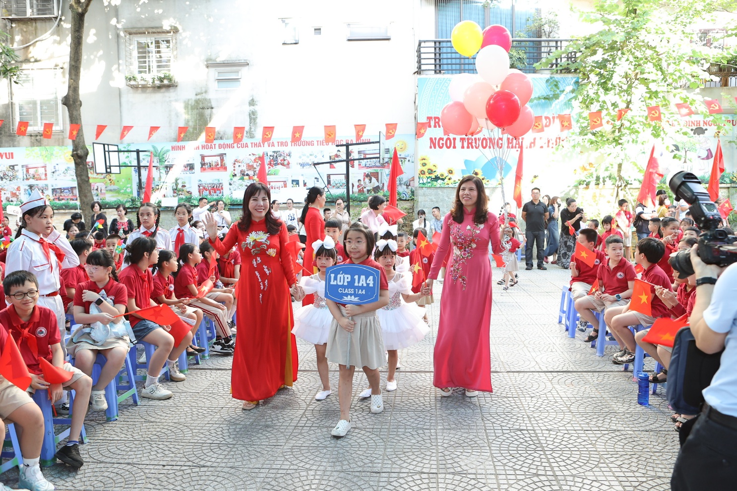 A group of people in red dresses walking down a street

AI-generated content may be incorrect.