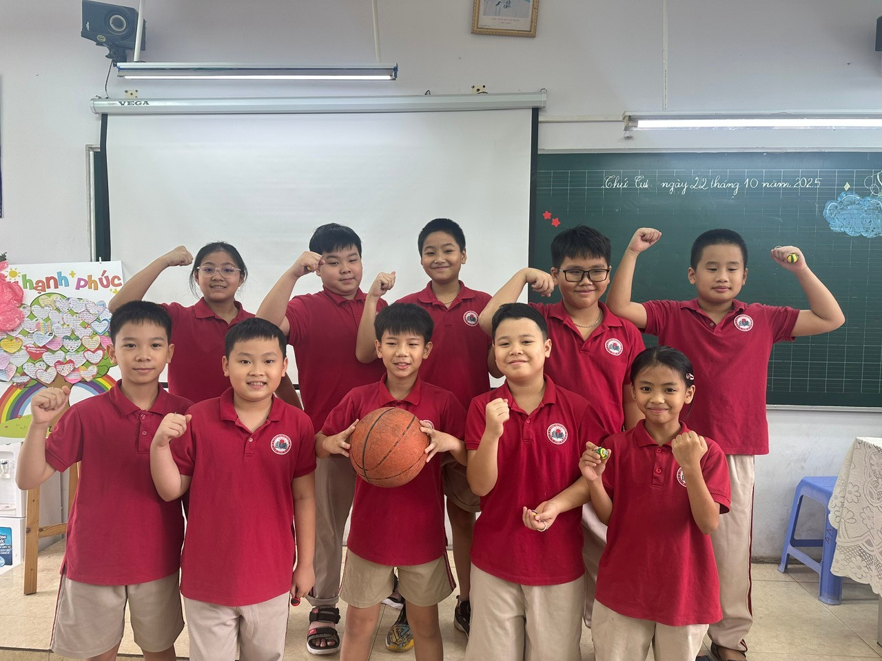 A group of children in red shirts

Description automatically generated