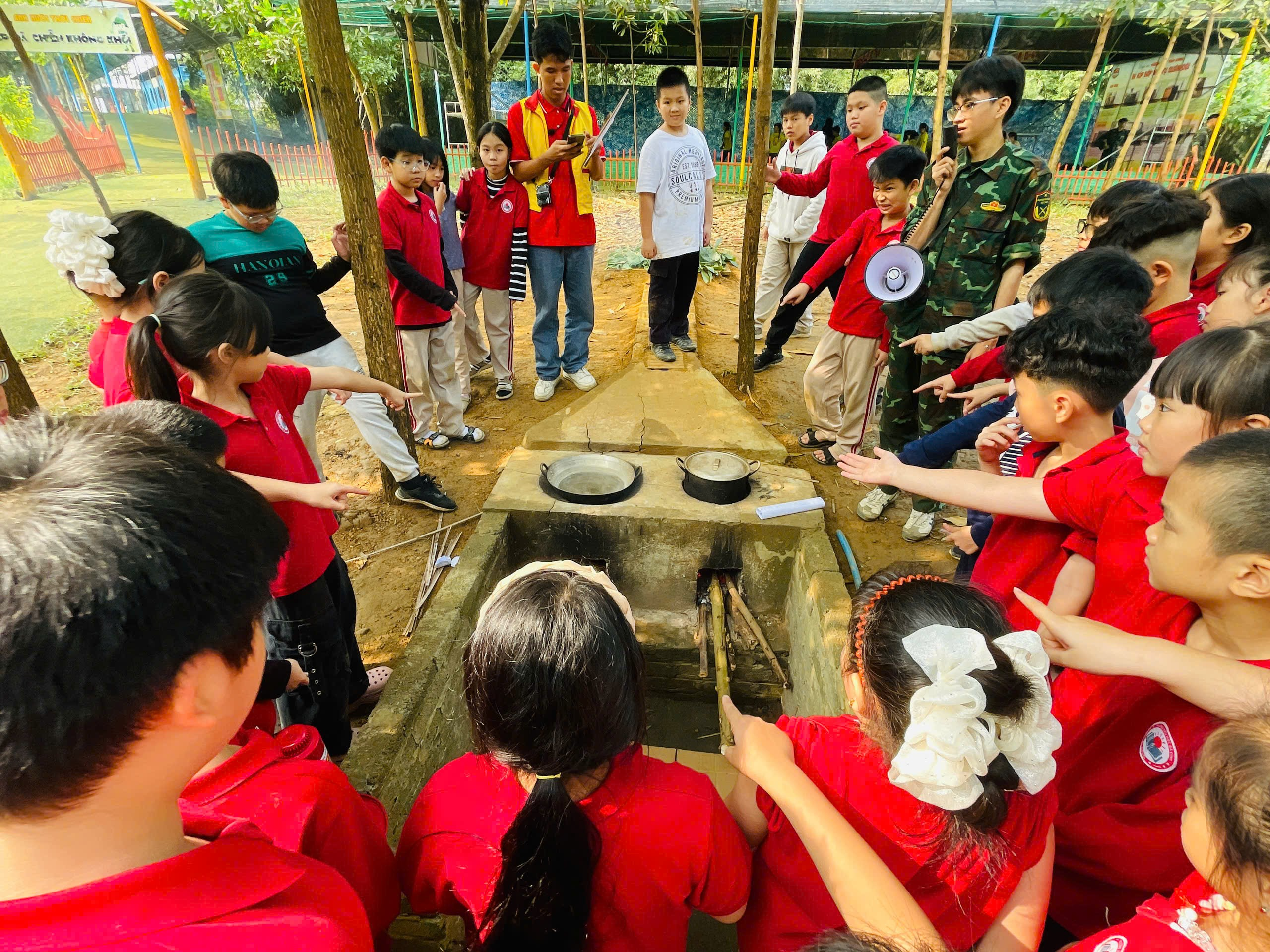 A group of children in red shirts

AI-generated content may be incorrect.