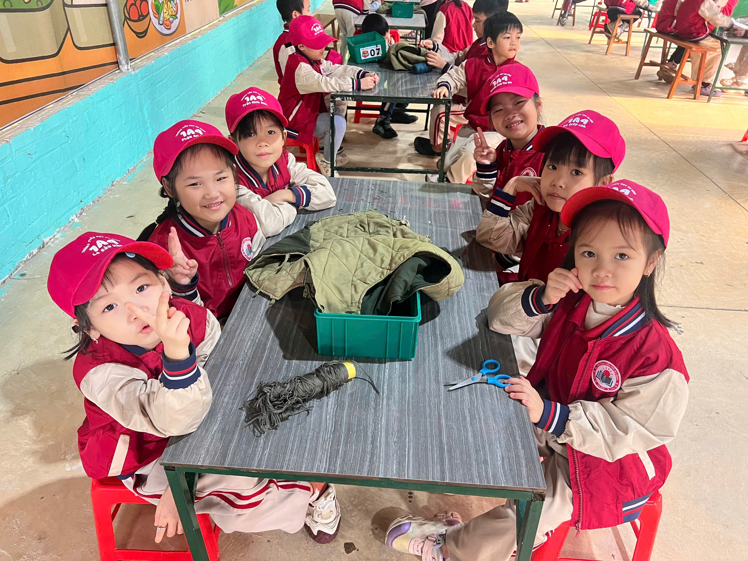 A group of children sitting at a table

AI-generated content may be incorrect.