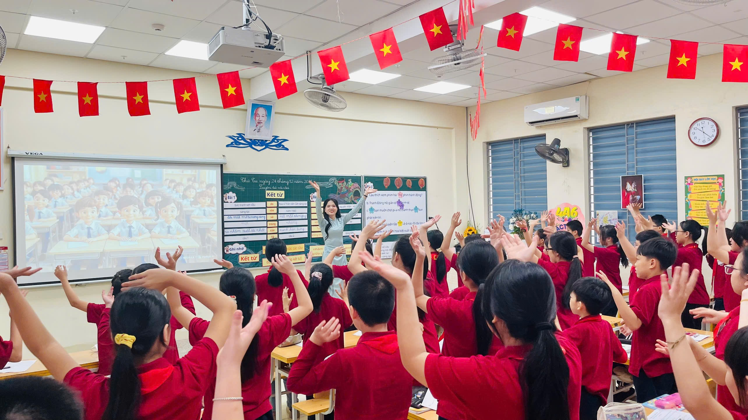 A group of people in a classroom raising their hands

Description automatically generated