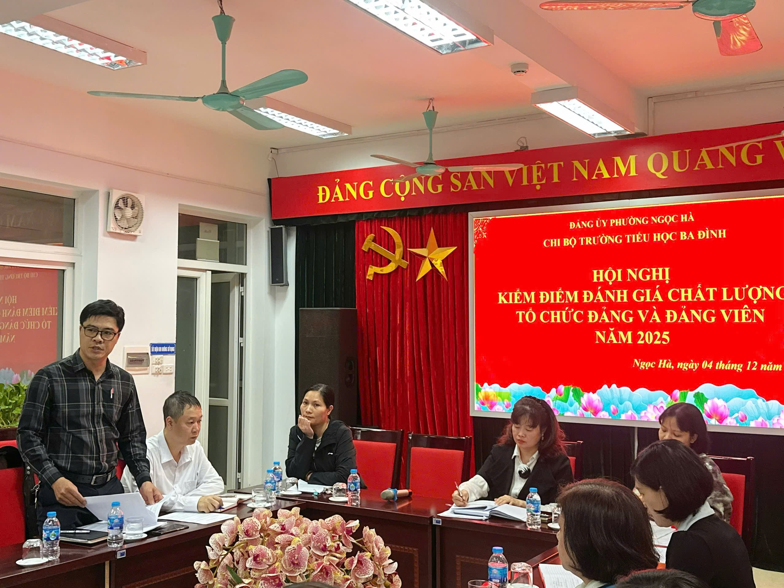 A group of people sitting at a table

Description automatically generated