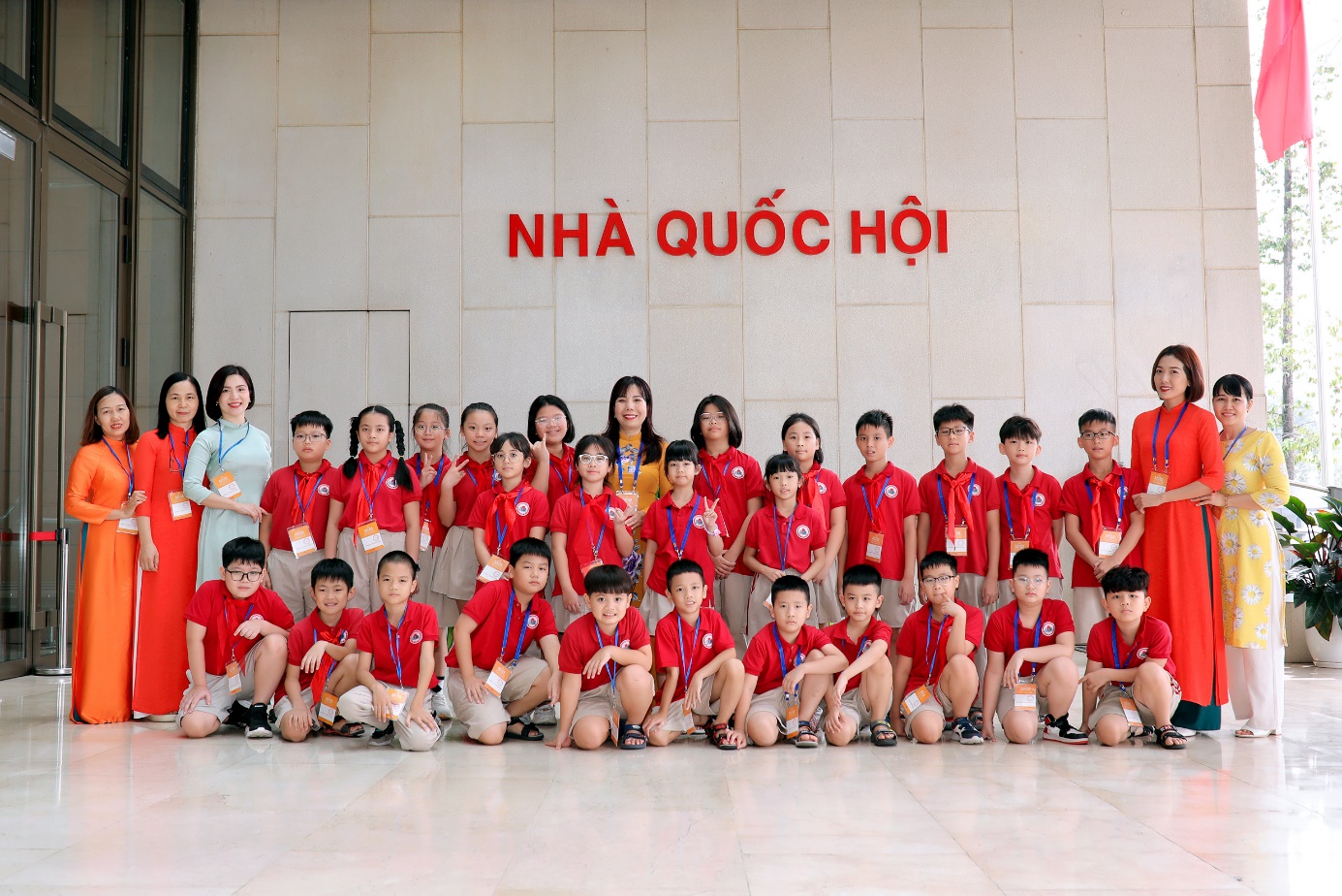 A group of people posing for a photo

Description automatically generated