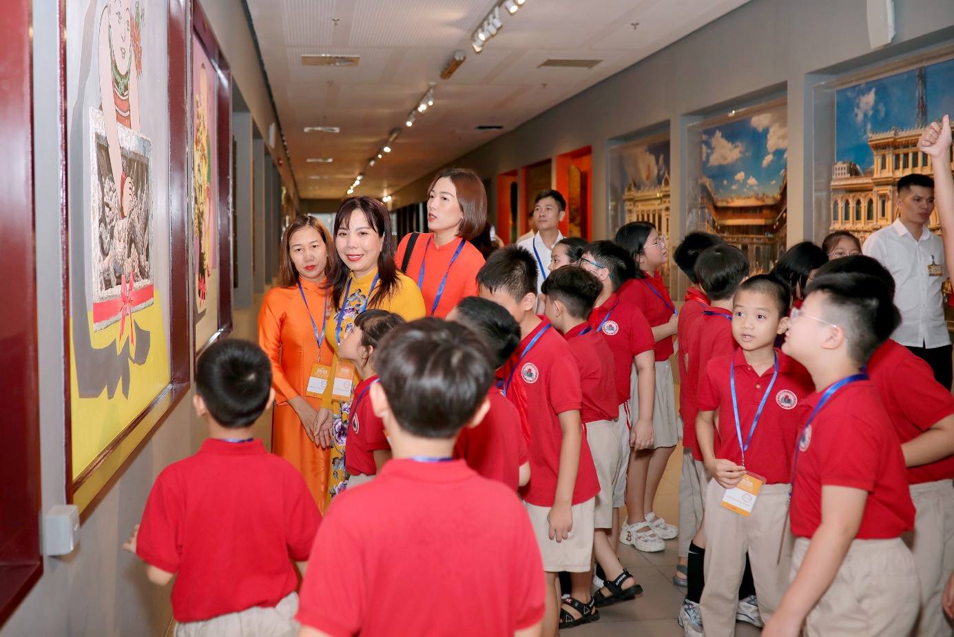 A group of people in red shirts

Description automatically generated