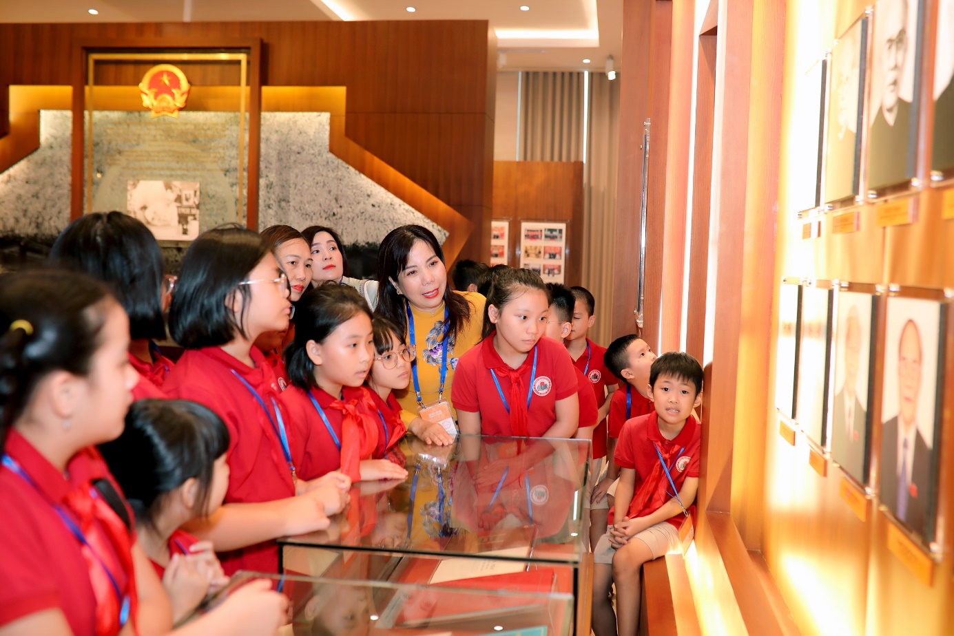 A group of children in red shirts

Description automatically generated