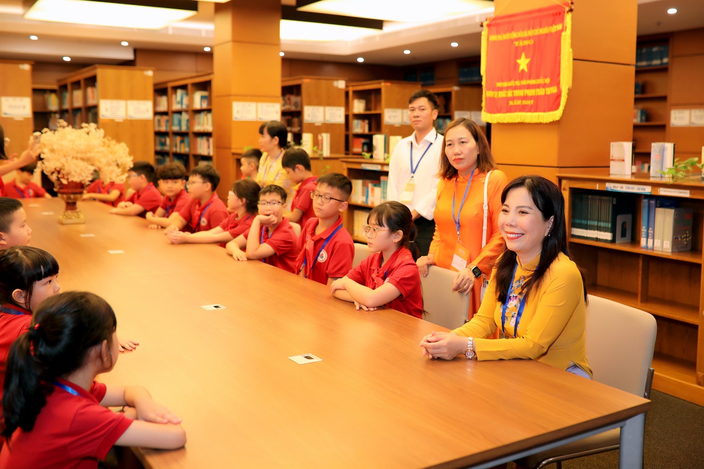 A group of people sitting at a table

Description automatically generated