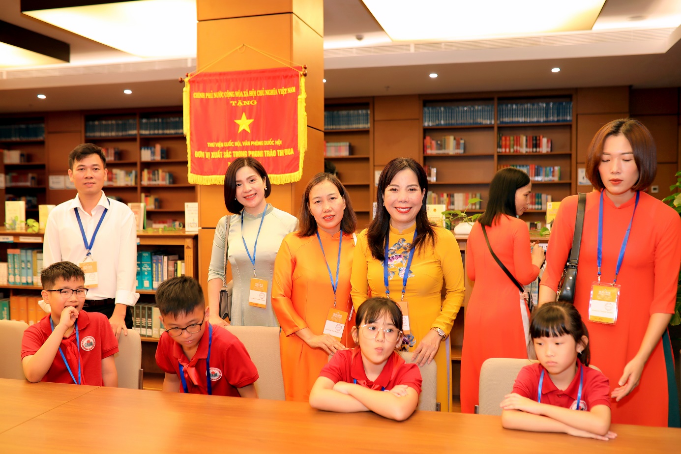 A group of people posing for a photo

Description automatically generated