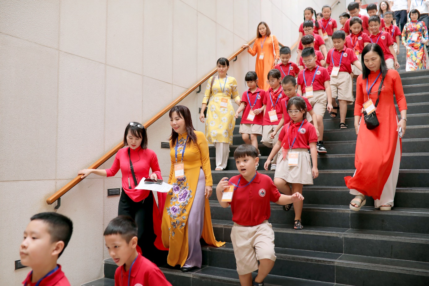 A group of people walking up stairs

Description automatically generated