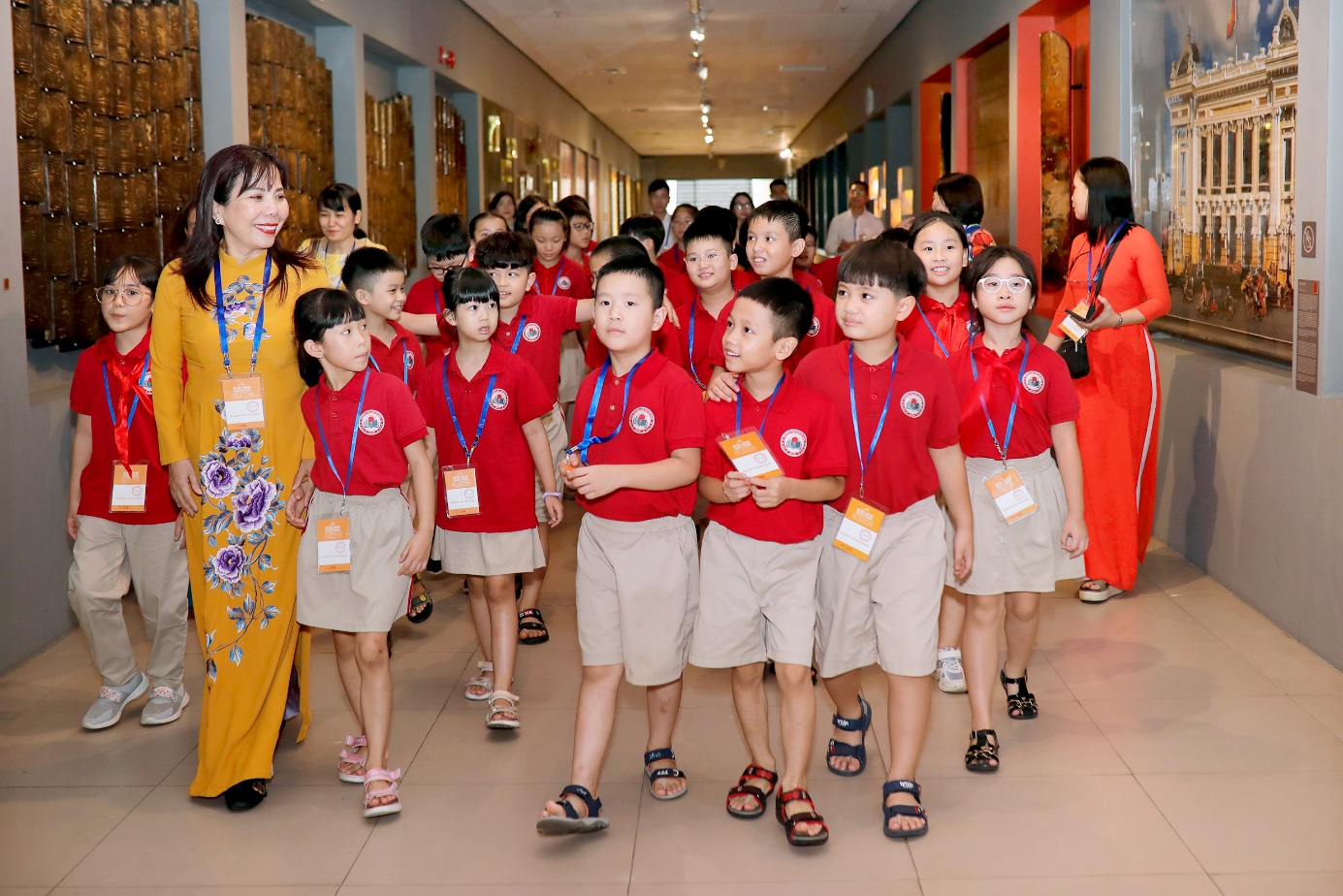 A group of children in red shirts

Description automatically generated