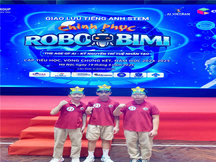 A group of boys standing in front of a poster

Description automatically generated