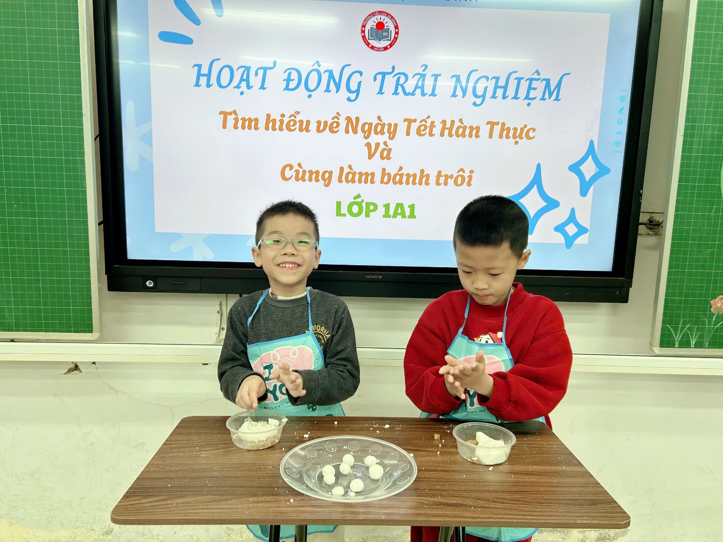 Two boys sitting at a table with food on it

AI-generated content may be incorrect.