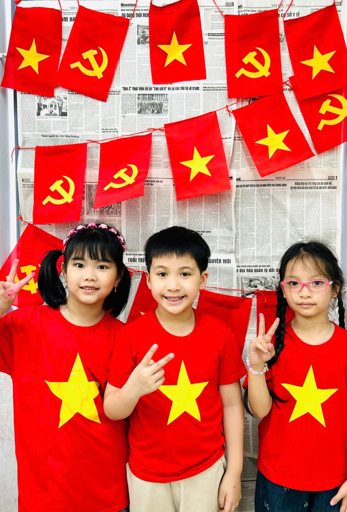 A group of children in red shirts with flags

AI-generated content may be incorrect.