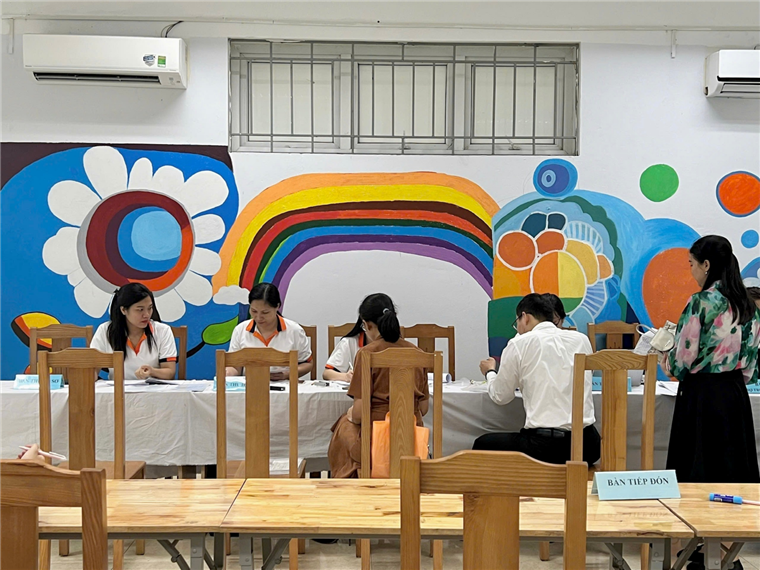 A group of people sitting at a table

Description automatically generated
