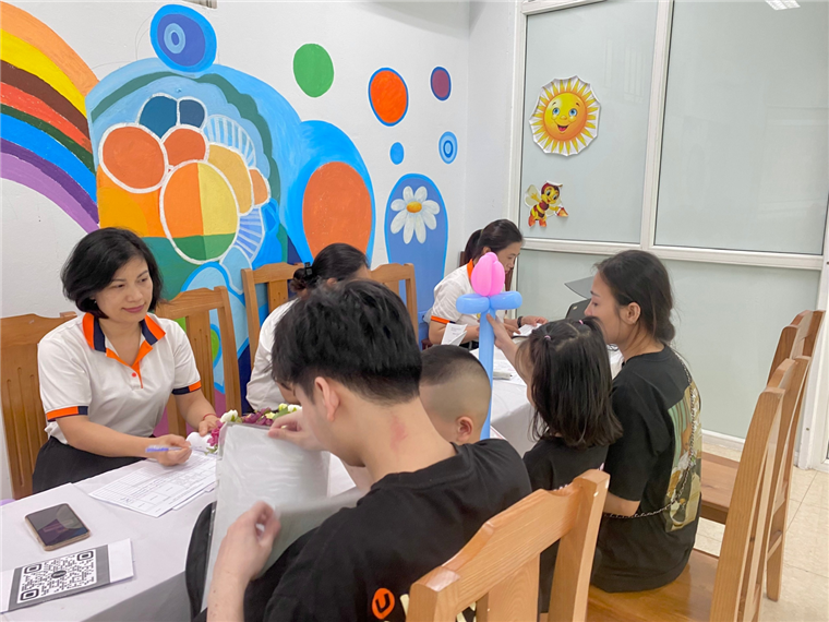 A group of people sitting at a table

Description automatically generated